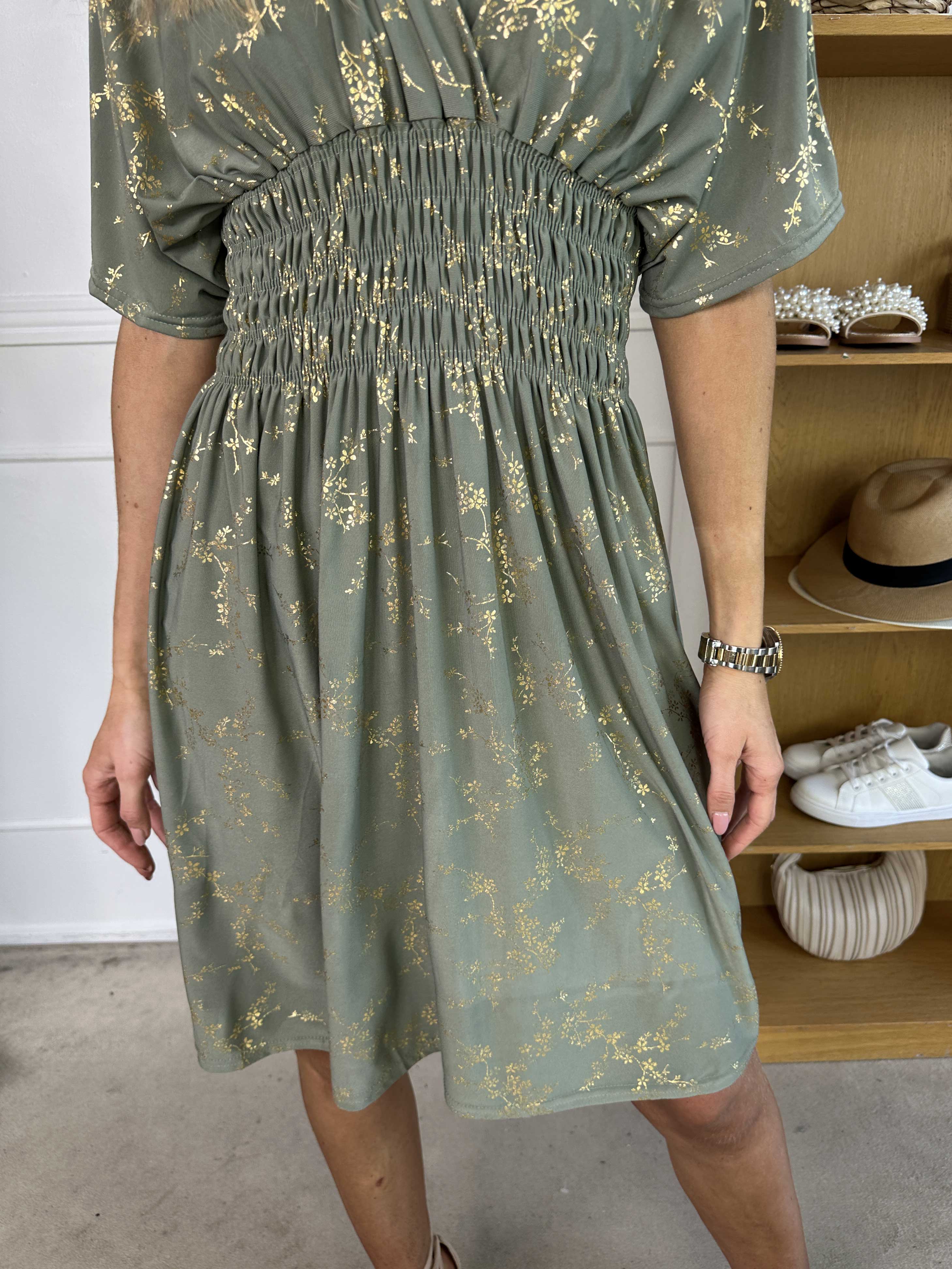 Pams Gold Short - Elastisk klänning detaljerad med guldblommor